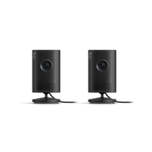 Two black Ring indoor plug-in cameras on stands, front view, with lenses centered and vented speaker grilles below.