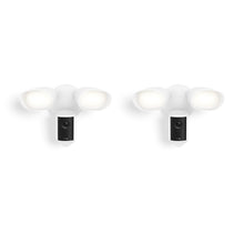 Two white outdoor floodlight camera units with dual LED lamps and a central lens, shown front-facing on a plain white background.