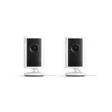 Plug-In / White / 2-pack:Indoor Cam Plus. Two white, cylindrical Indoor Cam Plus. Two devices are standing on a small circular base.