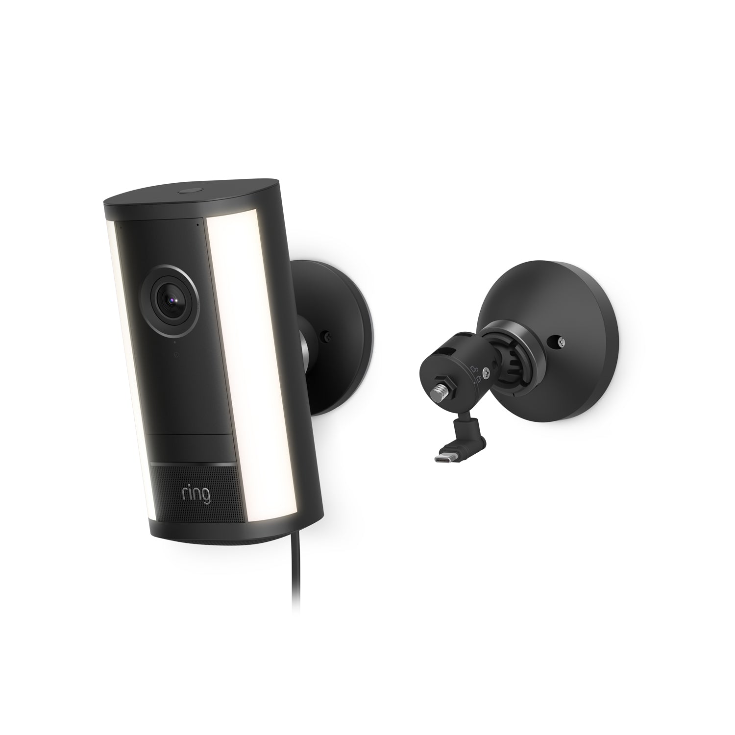 Black wall-mounted Spotlight Cam 4K Pro with vertical light panels, lens centered, power cable attached, shown with separate mounting bracket.