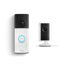 Ring video doorbell with glowing blue button next to a compact indoor security camera on a stand, both in white and black.