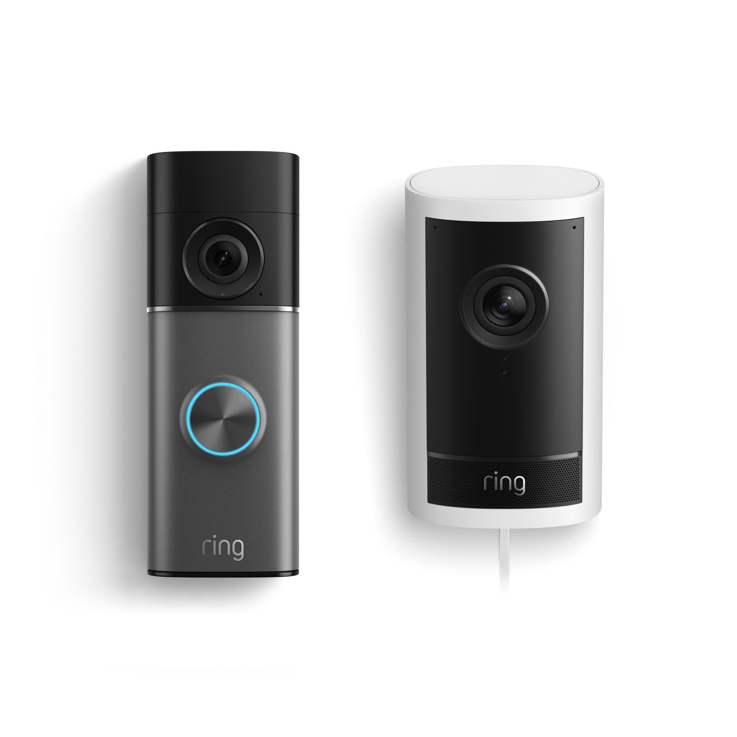 Two Ring devices on white background: a black doorbell with blue-lit button on the left, and a white plug-in indoor camera on the right.