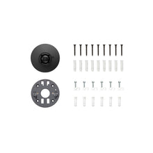 Black camera mount and grey mounting plate, screws, wall anchors, and cable clips arranged neatly on a white background.