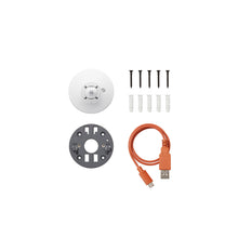 White camera mount with grey mounting plate, screws and anchors, and an orange USB-A to micro-USB cable arranged on a white background.
