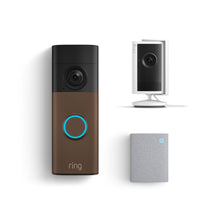 Ring smart home kit: bronze video doorbell with blue-lit button, white indoor camera on stand, and small gray chime.