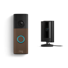 Ring doorbell with blue-lit button beside a small black indoor camera on a stand, both against a white background.