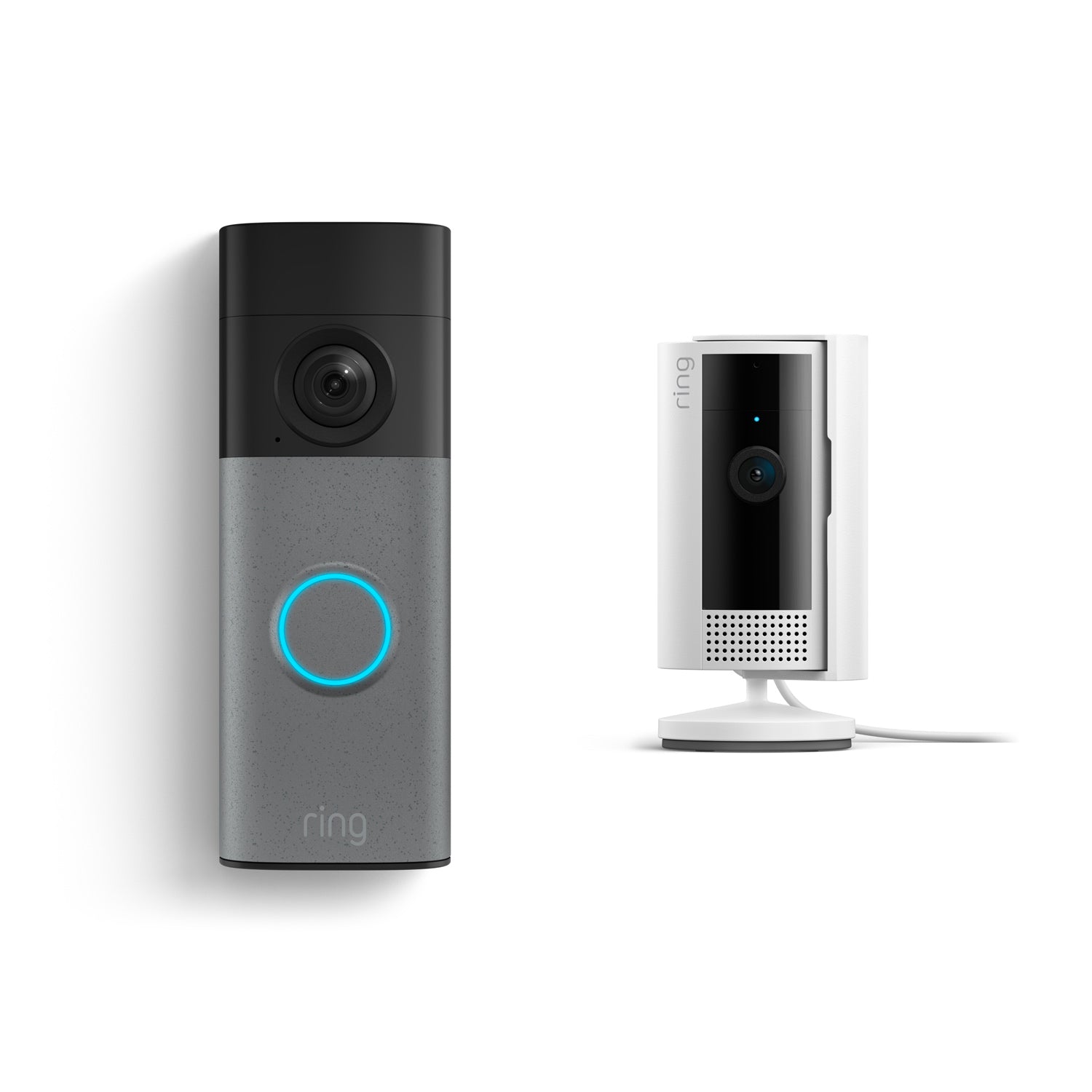 Ring video doorbell with glowing blue button beside a white indoor camera on a stand, both against a clean white background.
