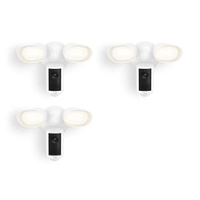 Set of three white outdoor floodlight camera units with dual LED lights and a central camera, shown against a plain white background.