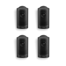 Set of four black Ring cameras arranged in a grid on a white background, each with a lens and small status light.