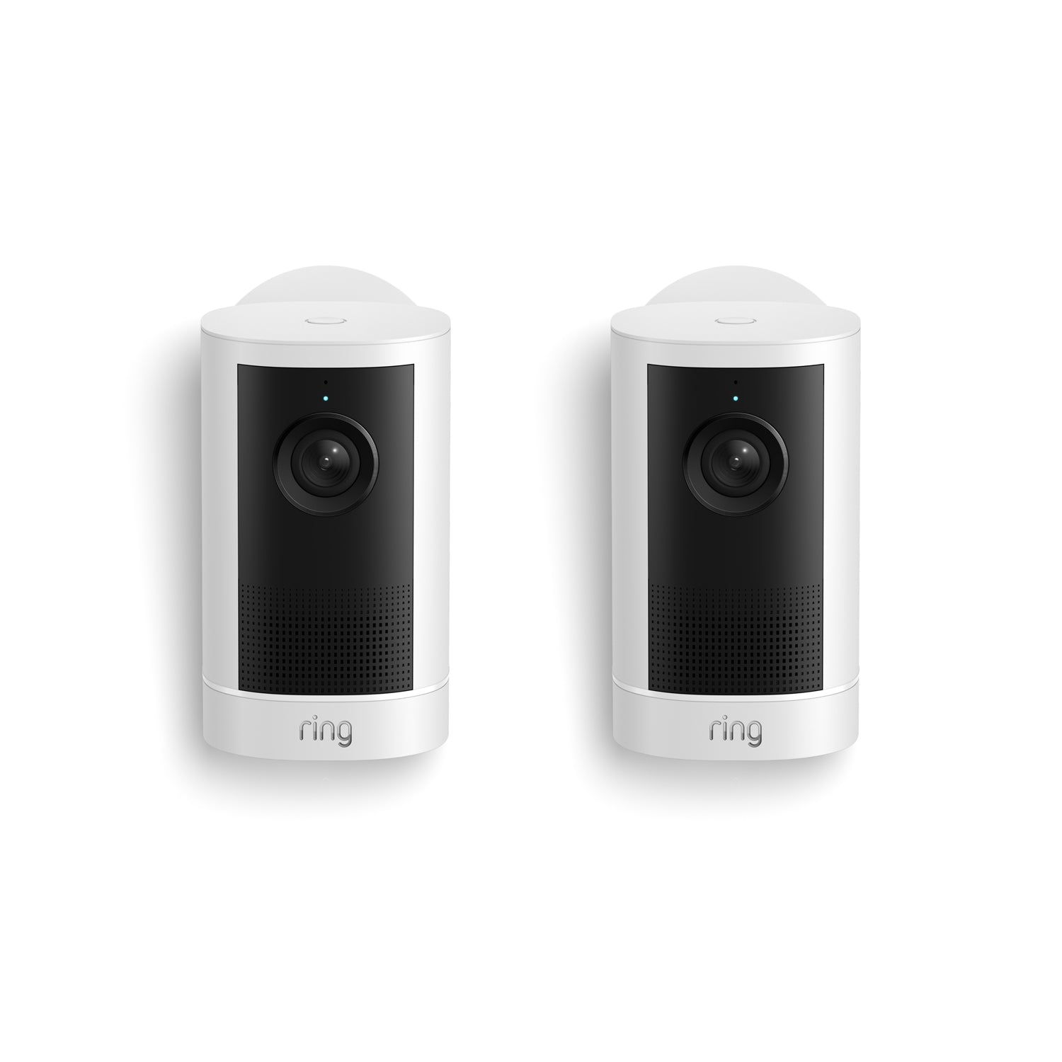 Two white Ring indoor security cameras side by side on a white background, each with a black lens panel and speaker grille.