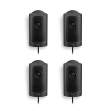 Set of four black Ring wired security cameras on a white background, each with lens, speaker grille, and power cord.