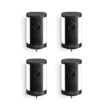 Set of four black Ring spotlight cameras with built-in lights, arranged in a grid on a white background.