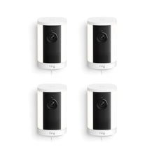 Set of four white and black Ring spotlight cameras with cylindrical design, front lens, speaker grille, and cords against a white background.