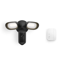 Ring Floodlight Cam 4K Plus (Wired) in black with a white Window & Door Sensor.