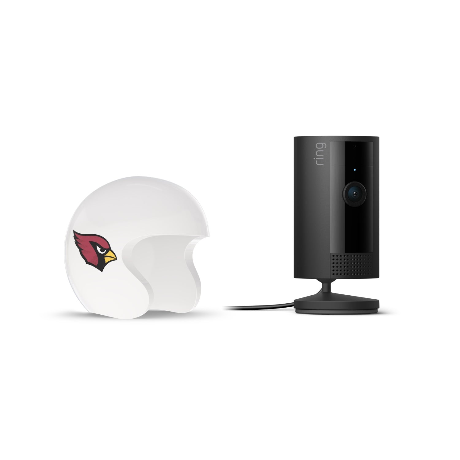 Black Ring indoor camera on a stand beside a white helmet-shaped cover with a red cardinal logo, set against a white background.