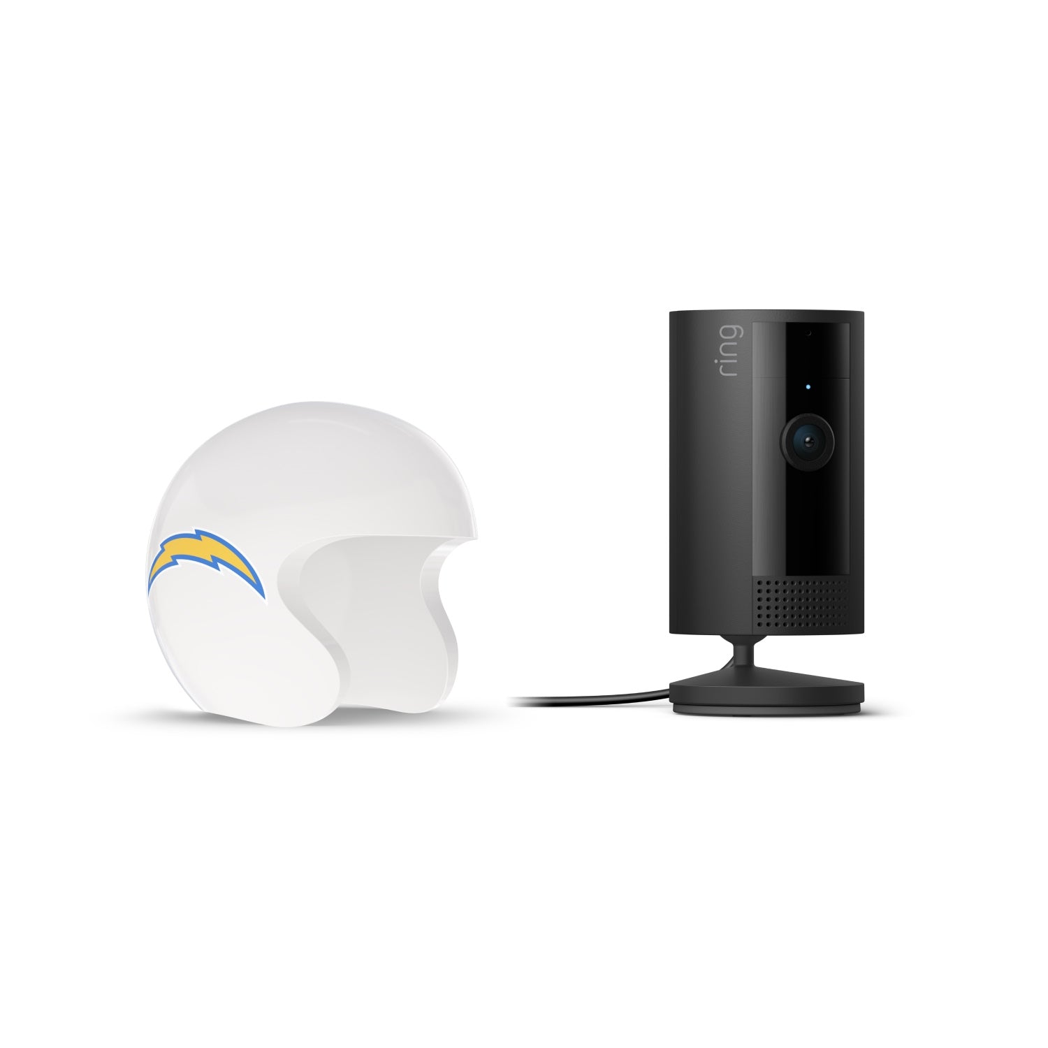 Black Ring indoor camera on a stand next to a white football helmet with a blue-and-yellow lightning bolt logo on a white background.