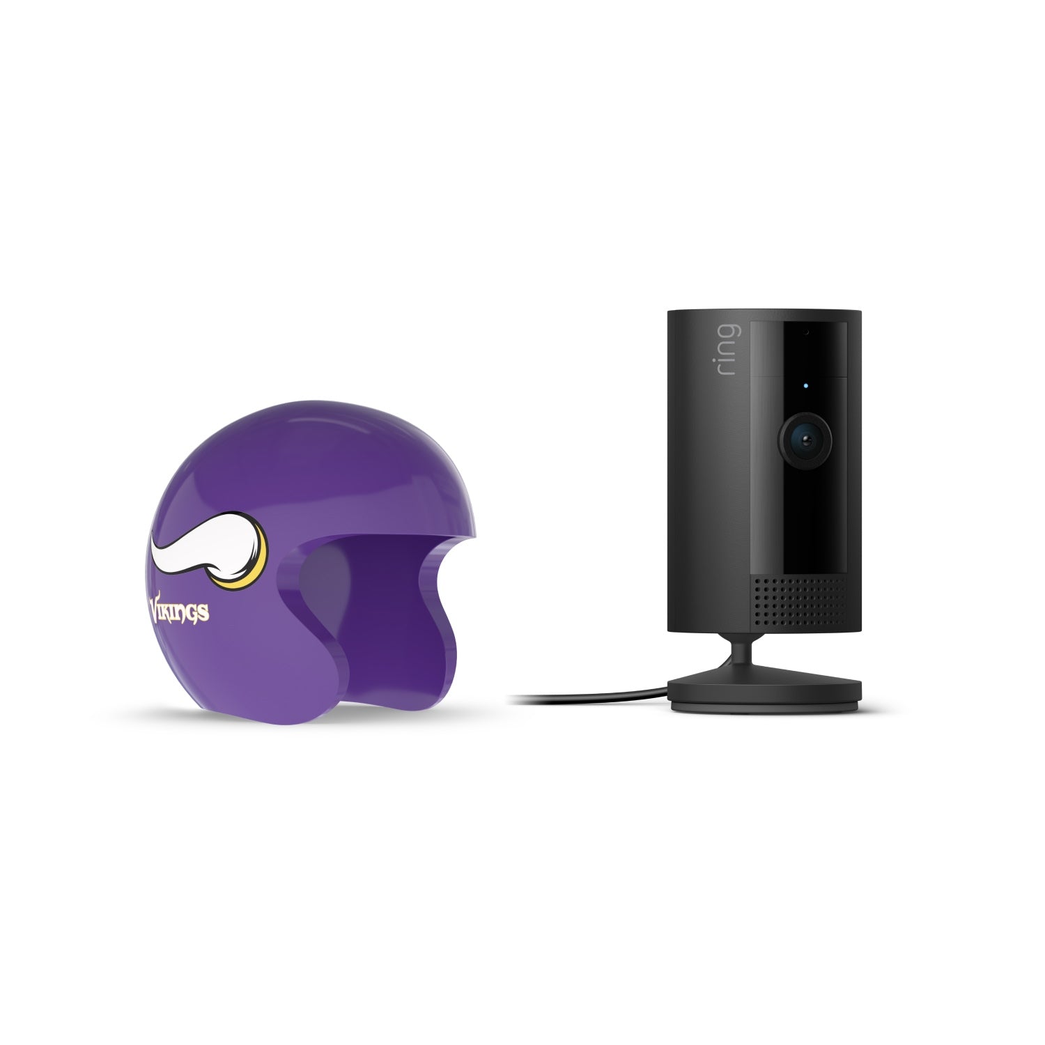 Black Ring indoor camera on a stand next to a purple Minnesota Vikings mini helmet on a white background.