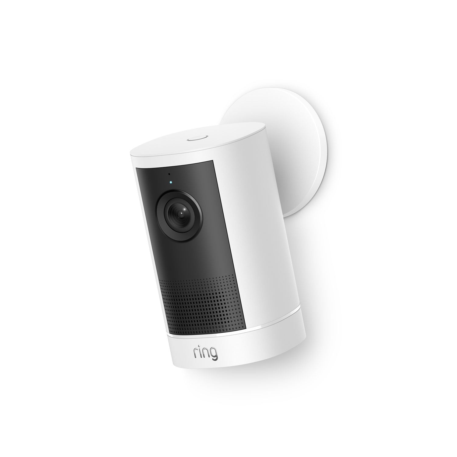 White Ring outdoor camera mounted on a wall, featuring a black front panel with lens, LED indicator, and speaker grill.