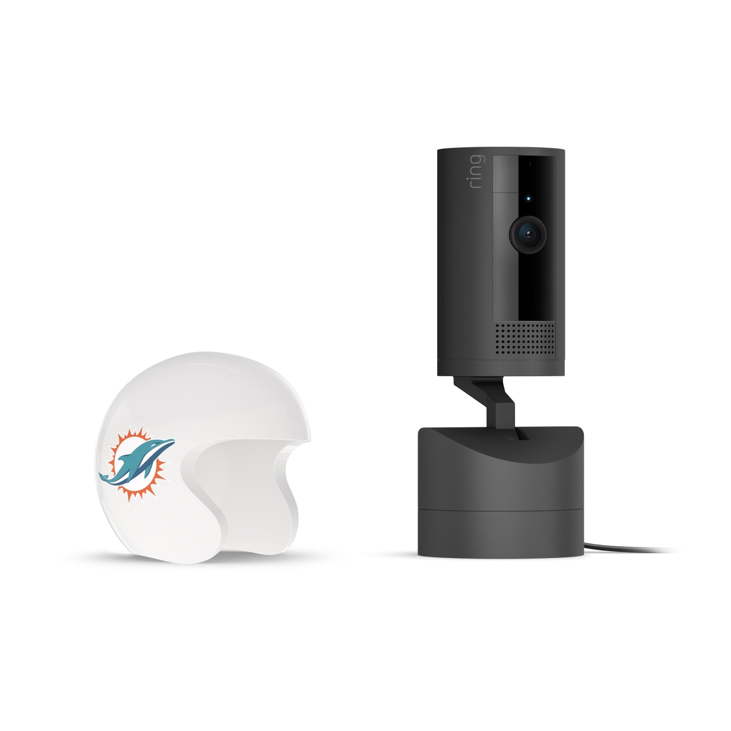 Black Ring indoor camera on a stand next to a white mini football helmet with a teal dolphin logo on a white background.