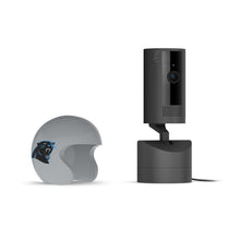 Black Ring indoor camera on a stand beside a gray mini football helmet with a blue-black panther logo on a white background.