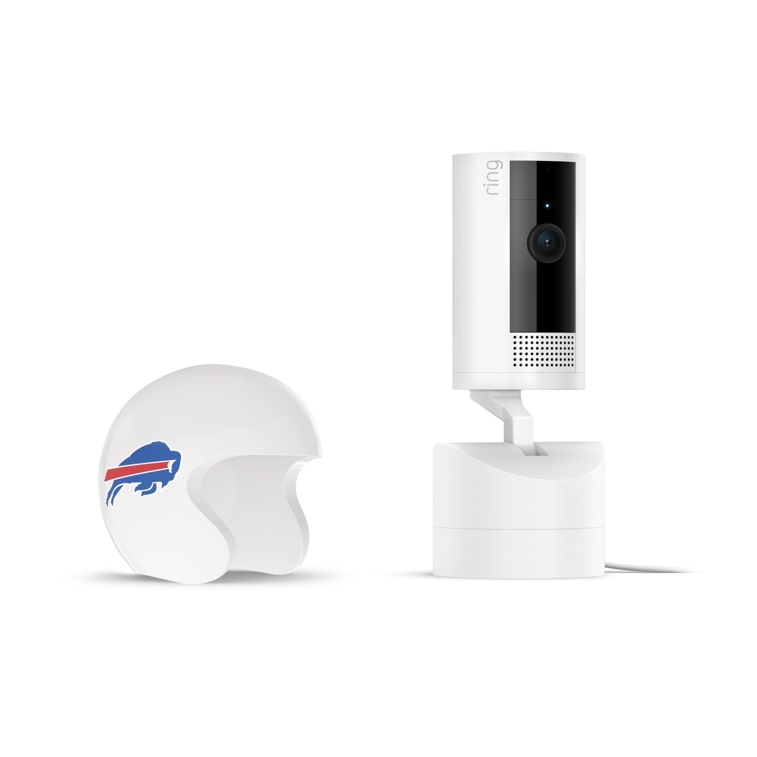 White Ring Pan-Tilt indoor camera on a stand next to a small white football helmet with a blue buffalo logo, on a plain white background.