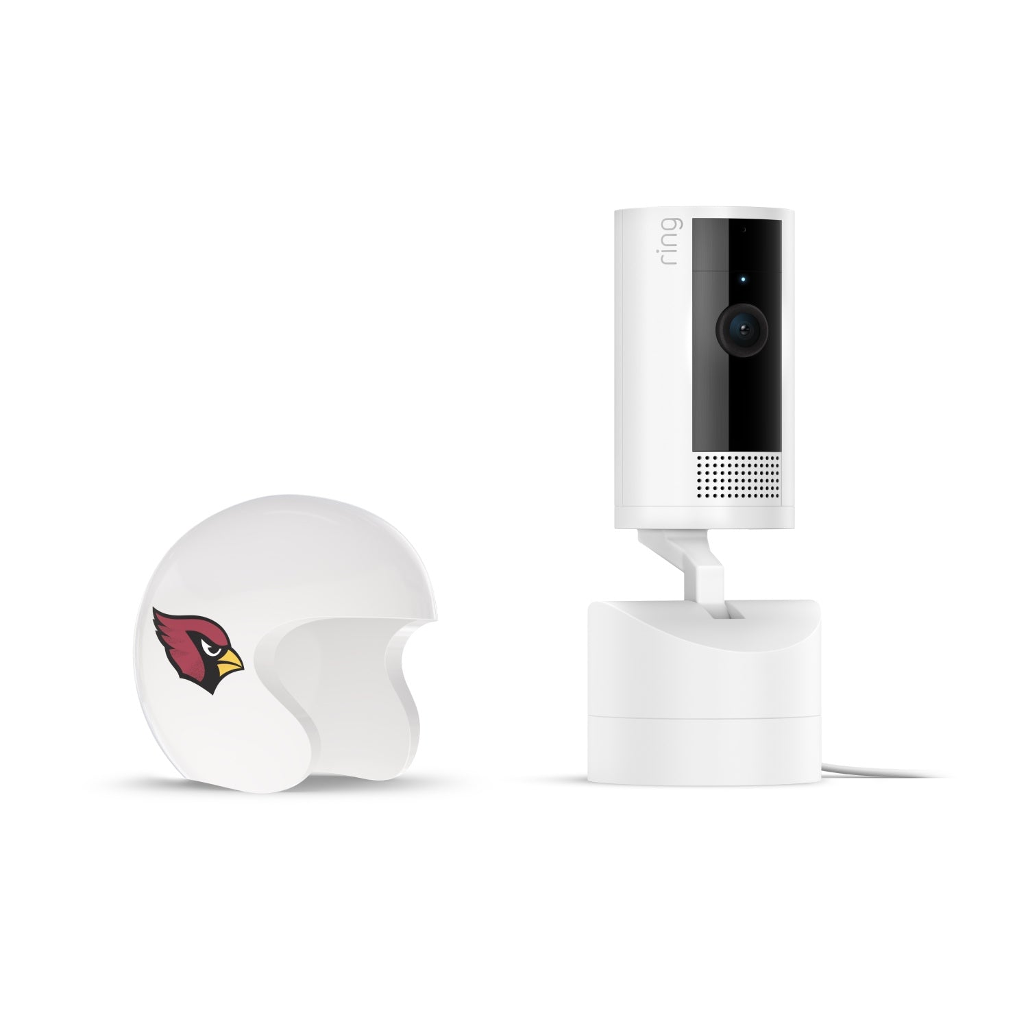 White indoor camera on a stand next to a small white helmet shell with a red bird logo, set on a plain white background.