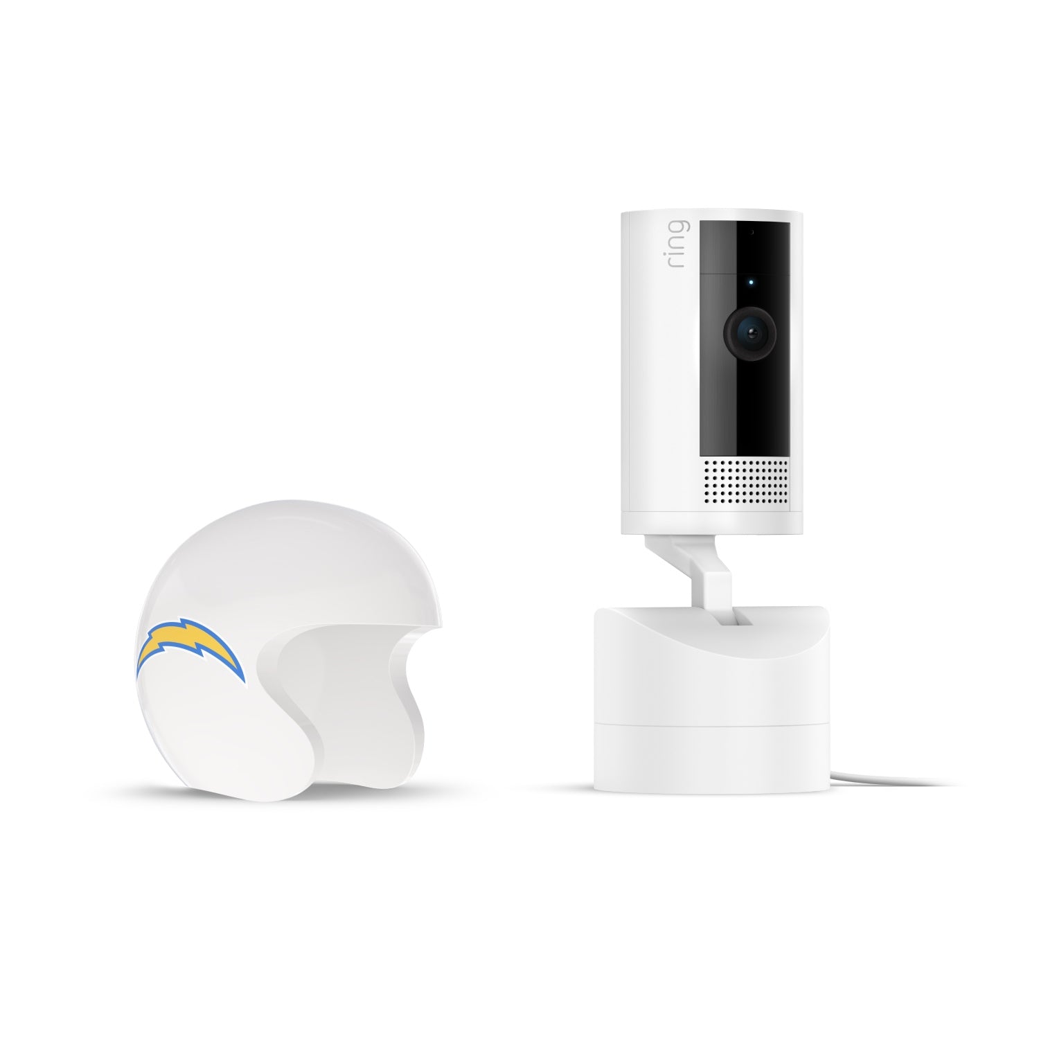 White Ring pan-tilt indoor camera on a stand next to a small white football helmet with a blue and yellow lightning bolt logo on the side.