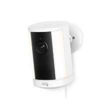 White Ring wired security camera mounted on a wall, with black center panel, lens, speaker grille, and two vertical LED light strips.
